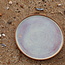 With the turntable handmade plate with speckled Pyerite clay and a beautiful magenta,rose high firing glaze.