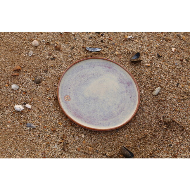 artisann With the turntable handmade plate with speckled Pyerite clay and a beautiful magenta,rose high firing glaze.