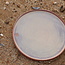 With the turntable handmade plate with speckled Pyerite clay and a beautiful magenta,rose high firing glaze.