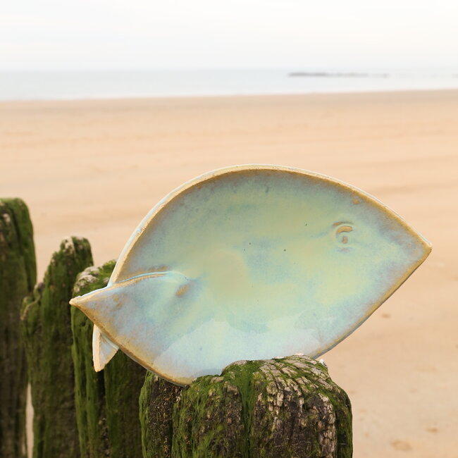 Green ceramic scale in the shape of a fish. Original dish for meats, cheese, appetizers, sushi ...
