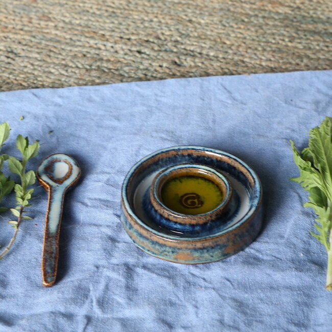 Handmade small ceramic oil dish with the turntable in a beautiful blue glaze