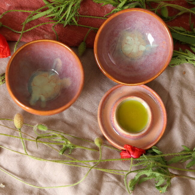 Handmade small ceramic oil dish with the turntable in a beautiful orange glaze