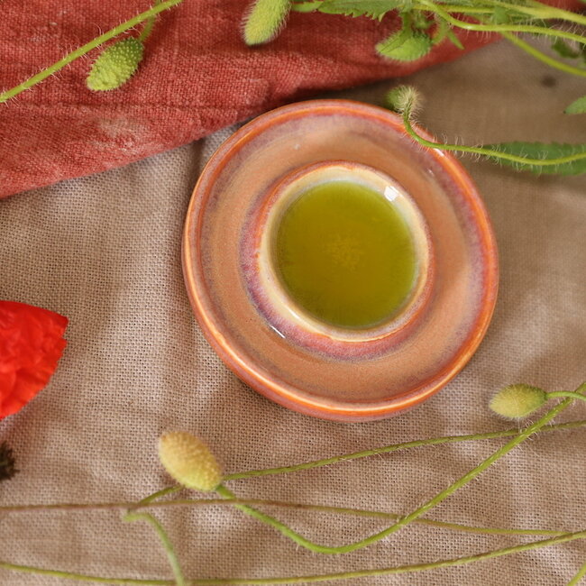 Handmade small ceramic oil dish with the turntable in a beautiful orange glaze