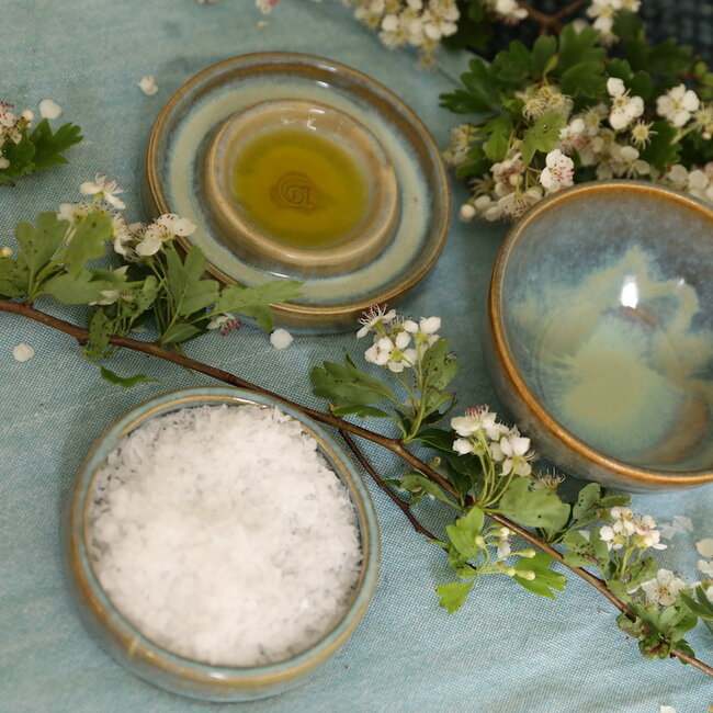 Handmade small ceramic oil dish with the turntable in a beautiful green mintglaze