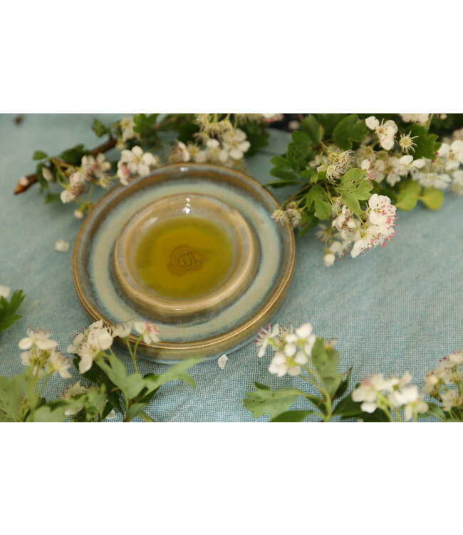 artisann Handmade small ceramic oil dish with the turntable in a beautiful green mintglaze