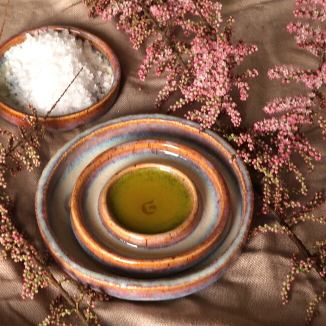 Handmade small ceramic oil dish with the turntable in a beautiful pink,red glaze