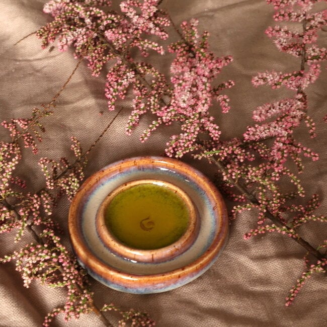 Handmade small ceramic oil dish with the turntable in a beautiful pink,red glaze