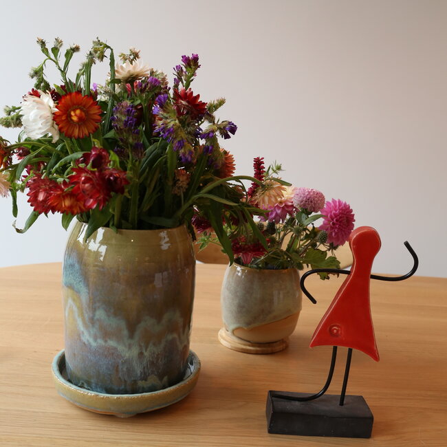 Art represented by a handmade ceramic statue is the symbol of unity, friendship, love, happiness, ... and so much more.