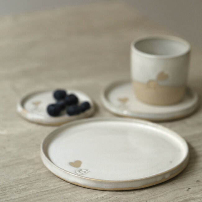 Handmade white ceramic cup from the tableware “White Love" with a little heart