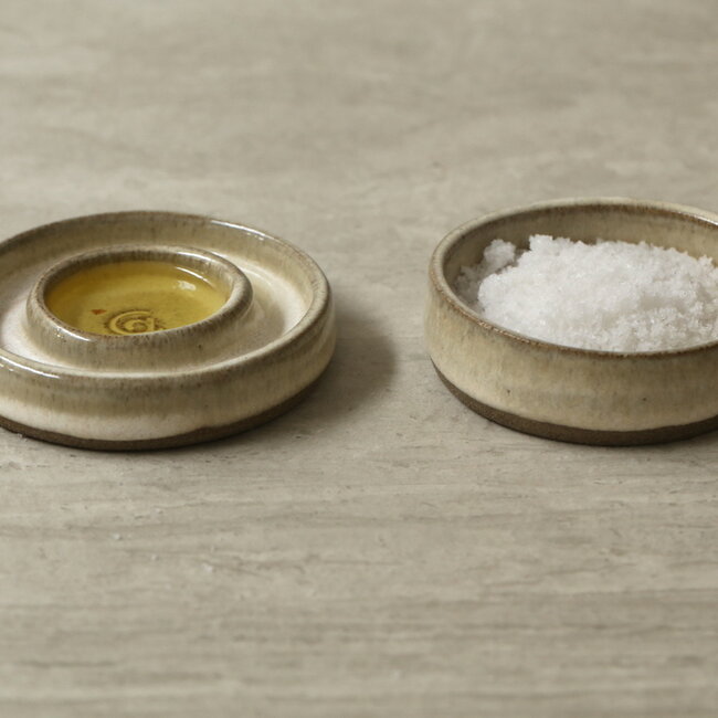 Handmade small ceramic oil dish with the turntable in a beautiful white glaze