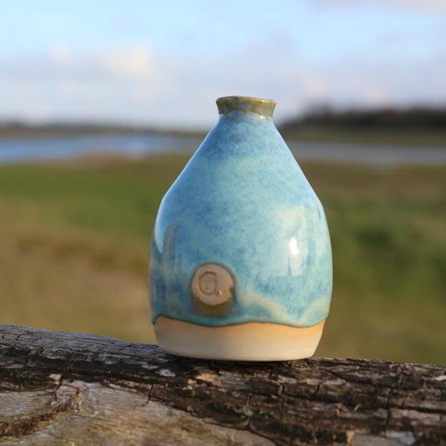 A ceramic handmade vase for one flower, twig... or simply as decoration