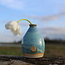 A ceramic handmade vase for one flower, twig... or simply as decoration