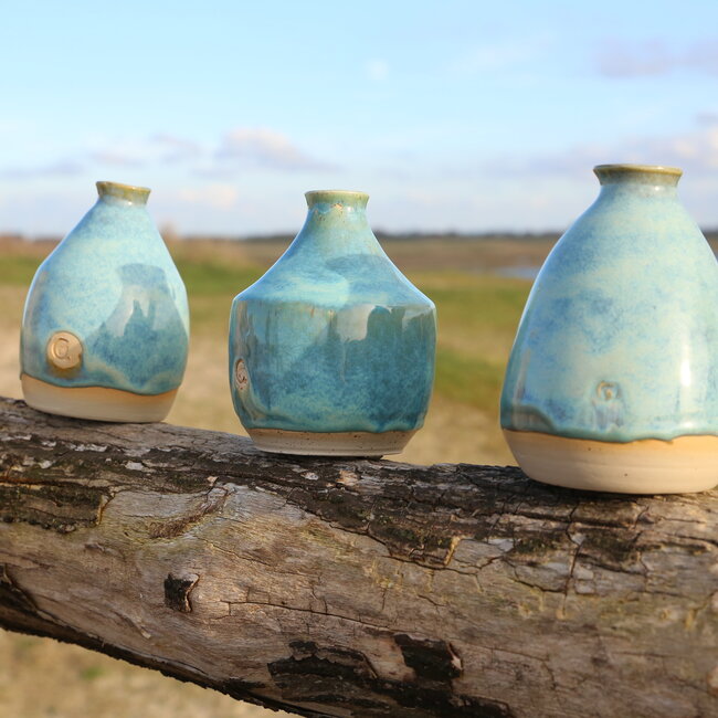 A ceramic handmade vase for one flower, twig... or simply as decoration