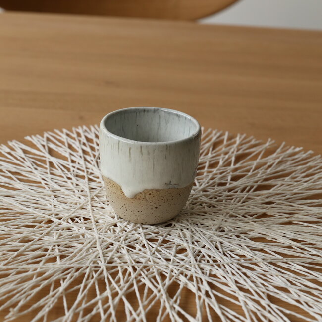 Contemporary, handmade ceramic cup from the tableware and collection “White Spots"
