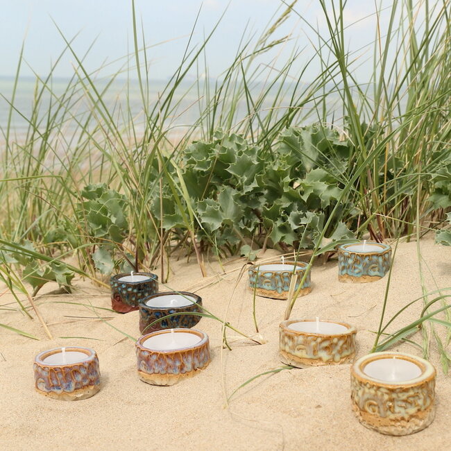 Handmade ceramic tealight holder decorated with the carving technique
