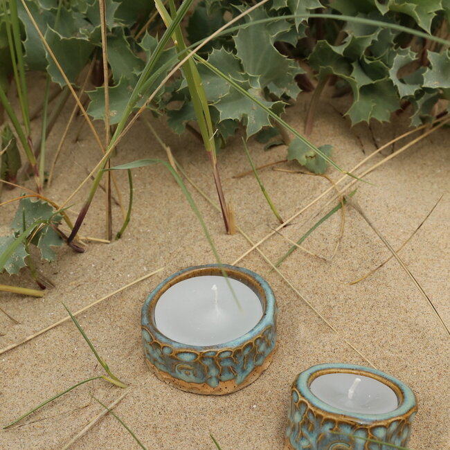 Handmade ceramic tealight holder decorated with the carving technique