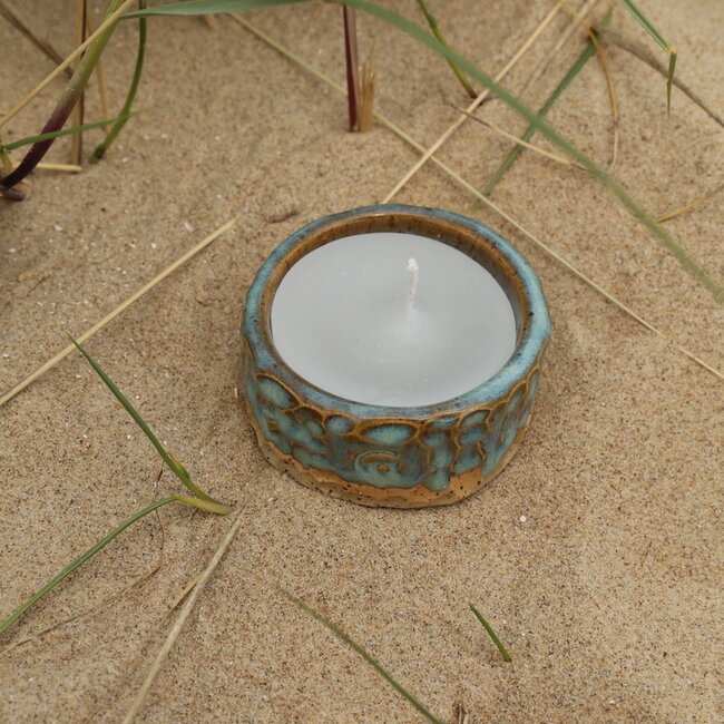 Handmade ceramic tealight holder decorated with the carving technique