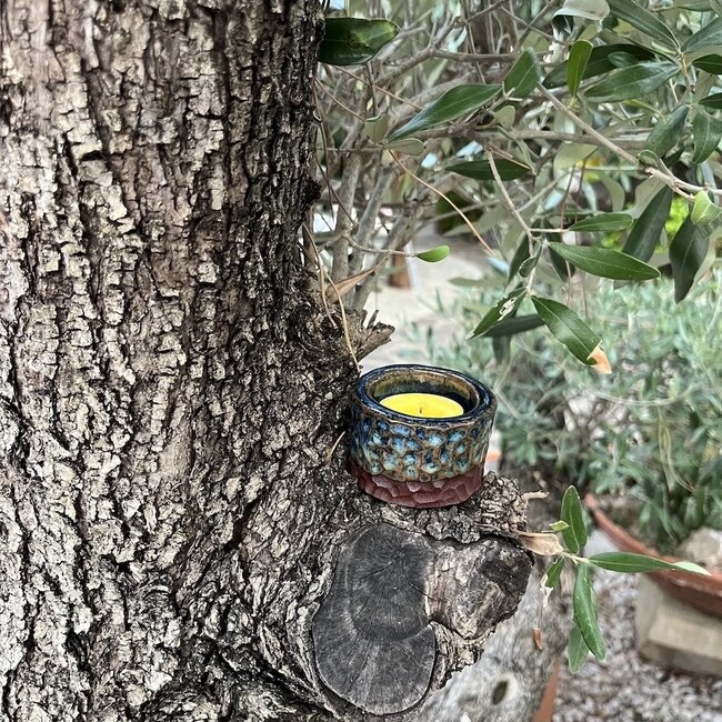 Handmade ceramic tealight holder decorated with the carving technique