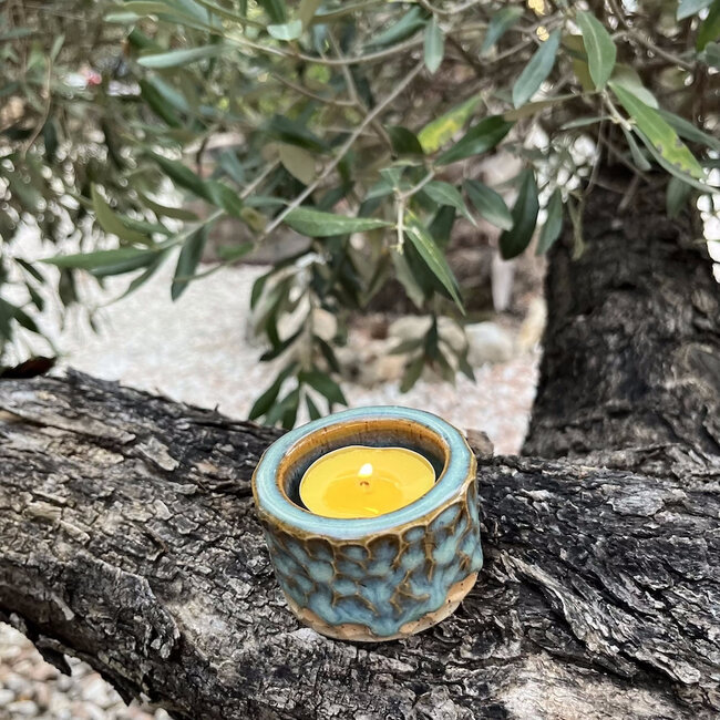Handmade ceramic tealight holder decorated with the carving technique