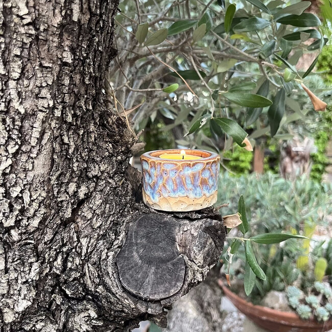 Handmade ceramic tealight holder decorated with the carving technique