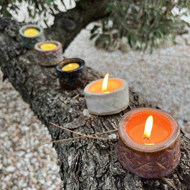 Handmade ceramic tealight holder decorated with the carving technique