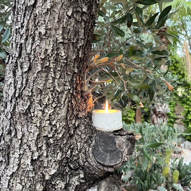 Handmade ceramic tealight holder decorated with the carving technique