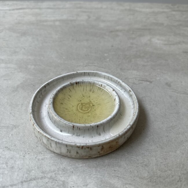 Handmade small ceramic oil dish with the turntable in a beautiful white glaze