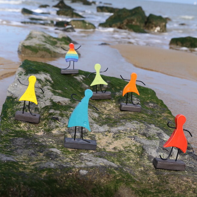 Art represented by a handmade ceramic statue in the rainbow colors is the symbol of unity, friendship, love, happiness, ... and so much more.