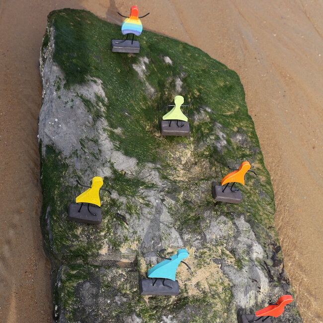 Art represented by a handmade ceramic statue in the rainbow colors is the symbol of unity, friendship, love, happiness, ... and so much more.