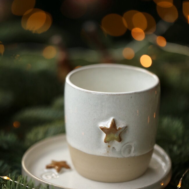 White handmade ceramic plate from the tableware and collection “White Star" with a musterd-colored star