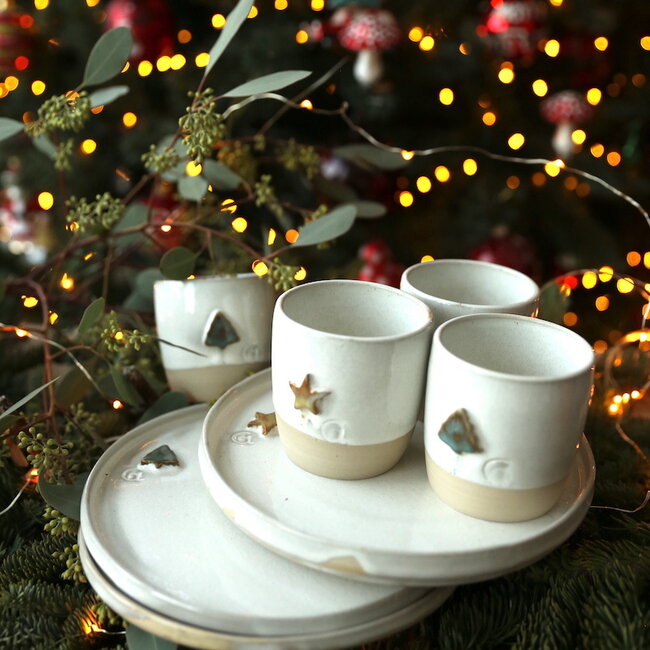 White handmade ceramic plate from the tableware and collection “White Christmas tree" with a mint-colored Christmas tree
