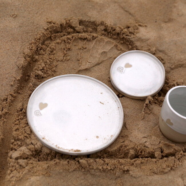 Handmade white ceramic cup from the tableware “White Love" with a little heart