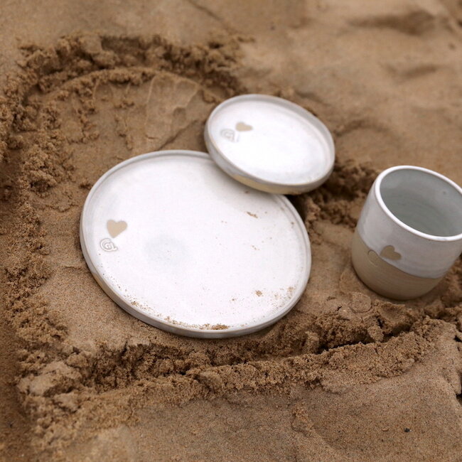 Handmade white ceramic plate from the tableware and collection “White Love" with a little heart