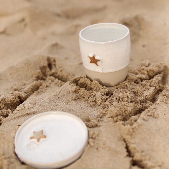 White handmade ceramic plate from the tableware and collection “White Star" with a musterd-colored star