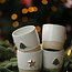 White handmade ceramic cup from the “White Tree” service with a mint-colored star