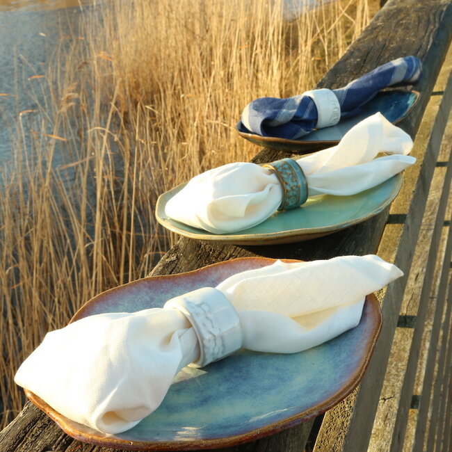 A unique hand-turned napkin ring finished with our white glaze
