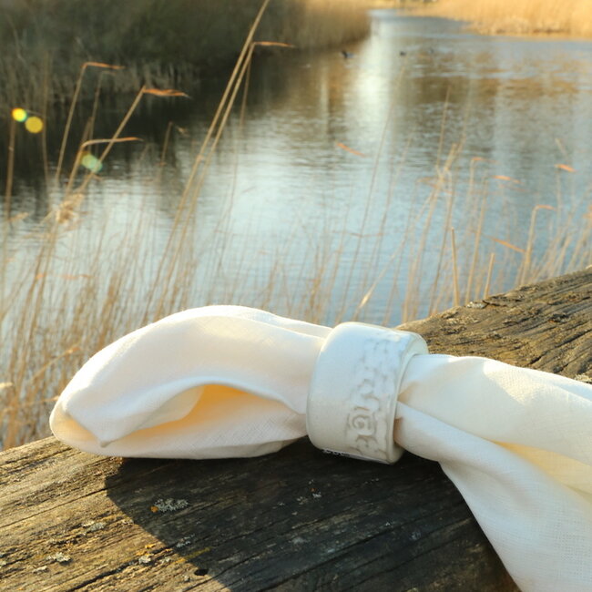 A unique hand-turned napkin ring finished with our white glaze