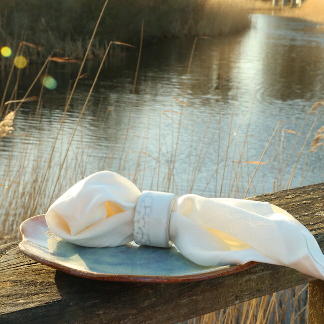 A unique hand-turned napkin ring finished with our white glaze