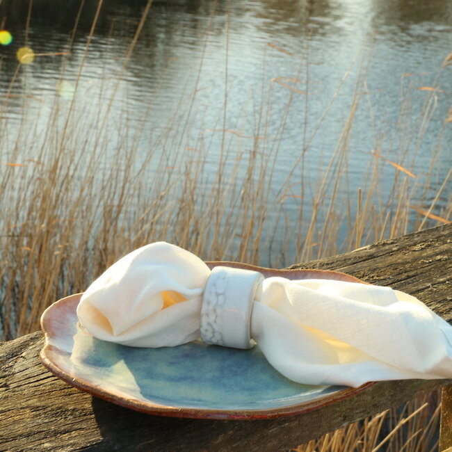 A unique hand-turned napkin ring finished with our white glaze