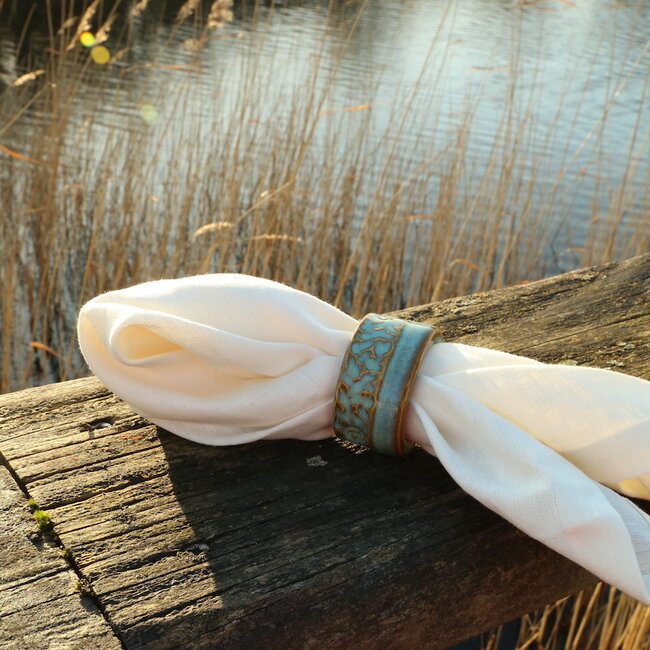 A unique hand-turned napkin ring finished with our mint glaze