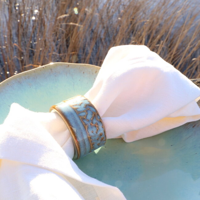A unique hand-turned napkin ring finished with our mint glaze