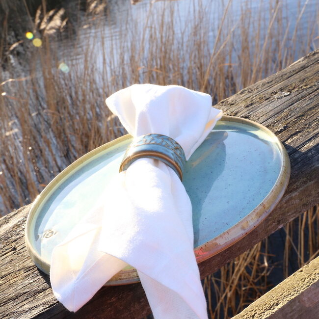 A unique hand-turned napkin ring finished with our mint glaze
