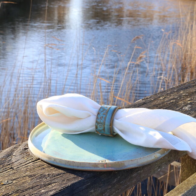 A unique hand-turned napkin ring finished with our mint glaze