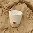 White handmade ceramic tea cup from the “White Heart” service with a sungreen-colored star