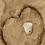 White handmade ceramic tea cup from the “White Heart” service with a sungreen-colored star