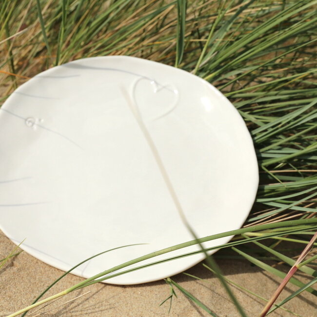 Unique handmade porcelain plate with a subtle heart incorporated