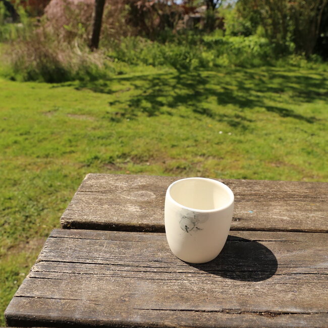 White porcelain cup with an artistic bubbles “Bulles” technique. Each cup is unique