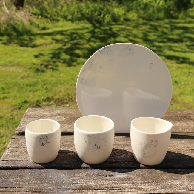 White porcelain cup with an artistic bubbles “Bulles” technique. Each cup is unique