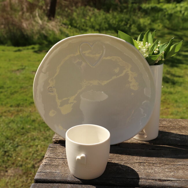 Unique handmade porcelain plate with a subtle heart incorporated
