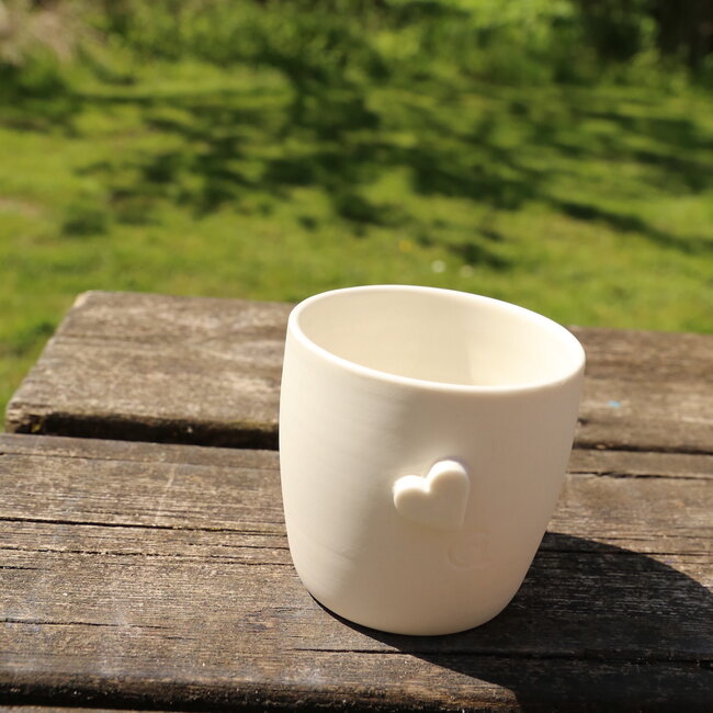 Unique handmade porcelain cup with a subtle heart incorporated